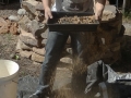 Sifting sand to remove pebbles